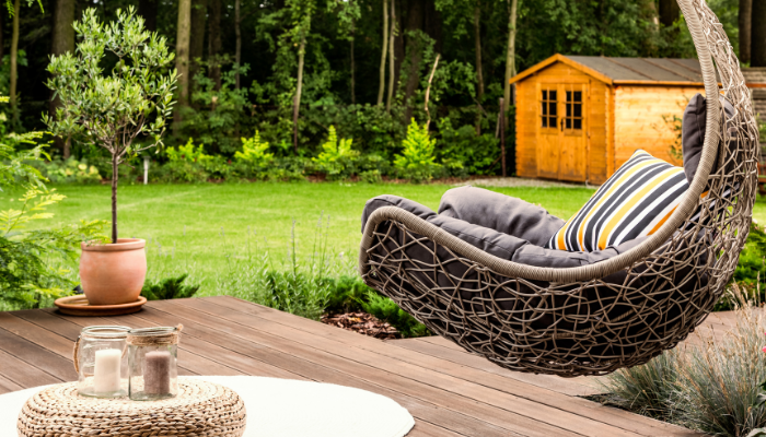 an accent chair placed in an outdoor balcony