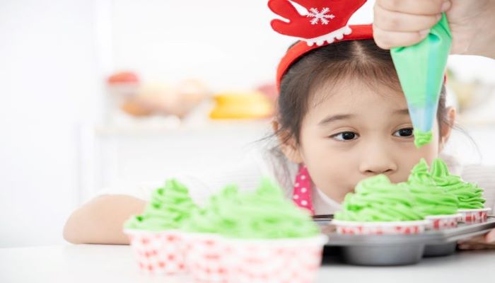 Kid baking cupcake